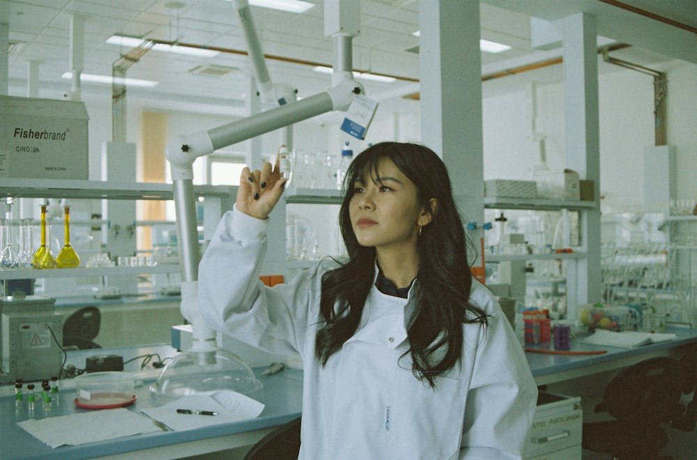 Scientist inspecting a sample under laboratory conditions