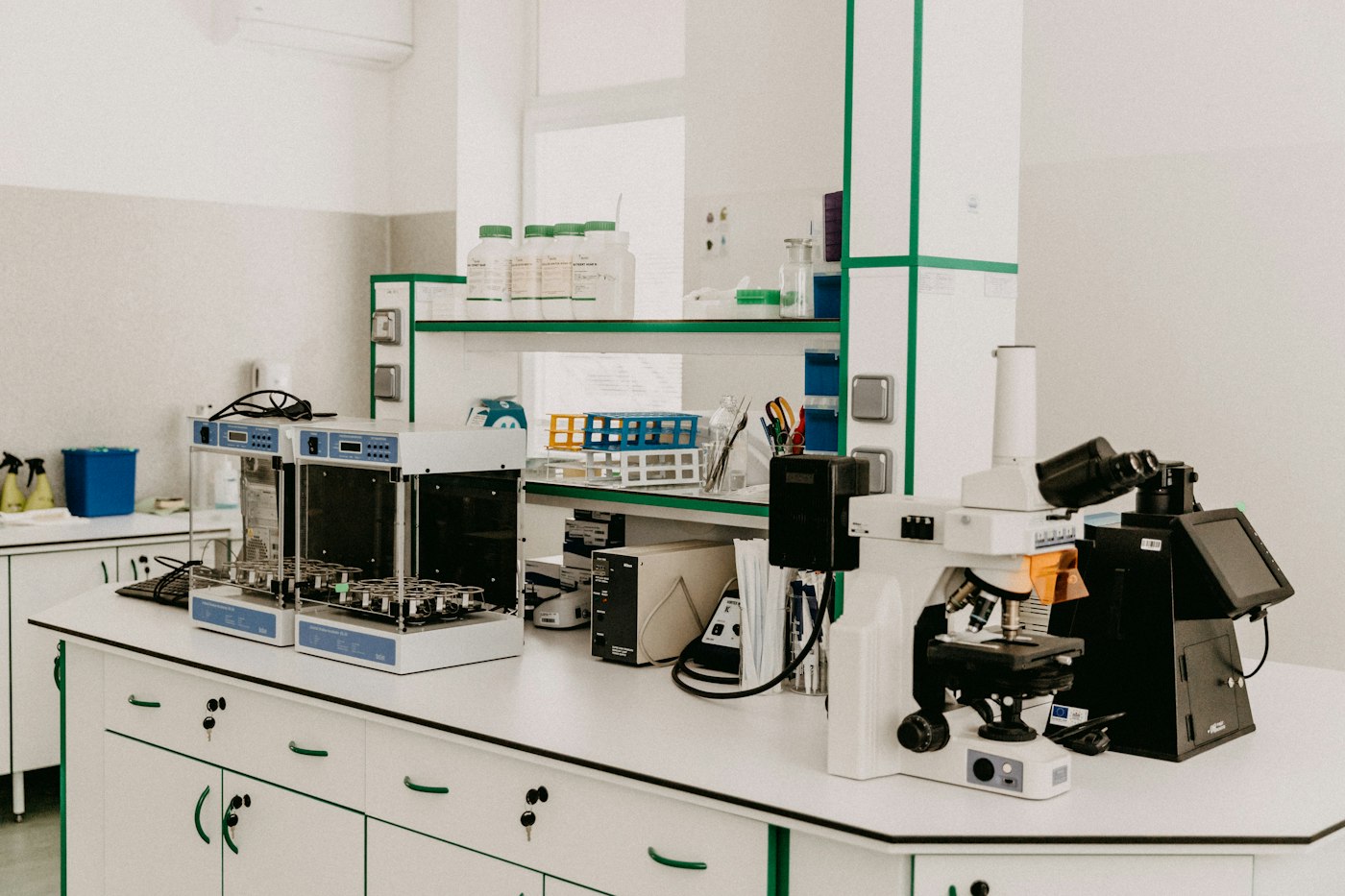 Analytical laboratory bench with instruments and a microscope